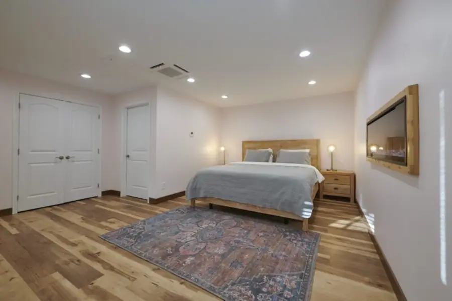 A cedar-chalet guest room in morning light